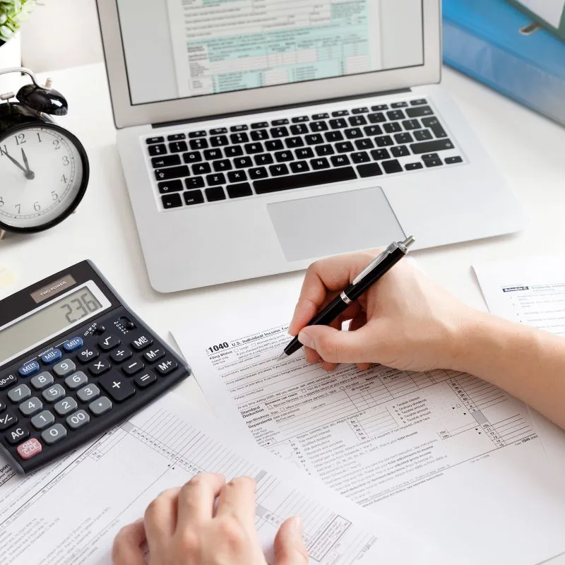 Two professionals reviewing financial documents together