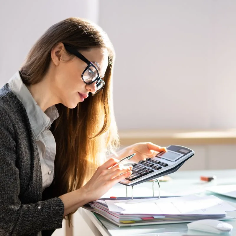 Payroll specialist reviewing pay period records