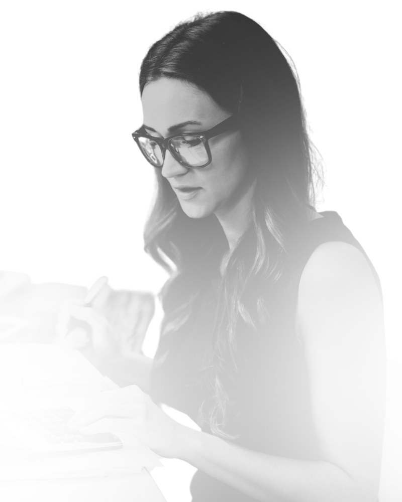 Accountant reviewing financial statements and reconciling records at a desk