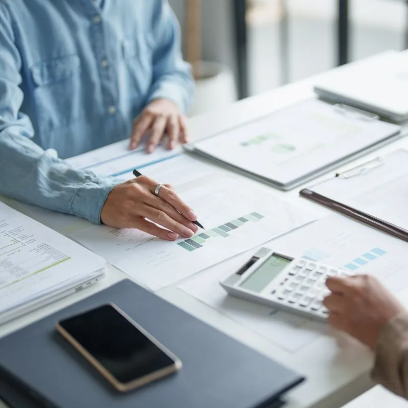Bookkeeper reconciling accounts and reviewing records